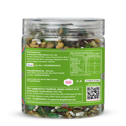 Clear jar with green label containing dried herbs on a white background